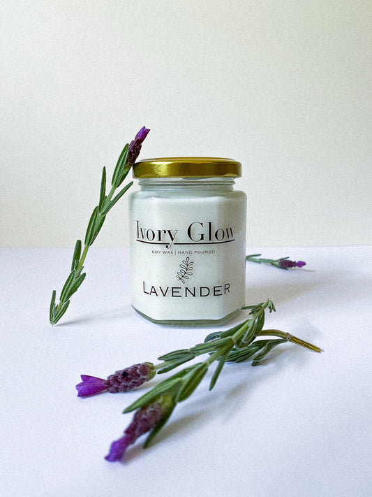 “Luxury lavender candle with a soothing floral aroma, made from vegan-friendly ingredients, displayed in an elegant glass jar.”