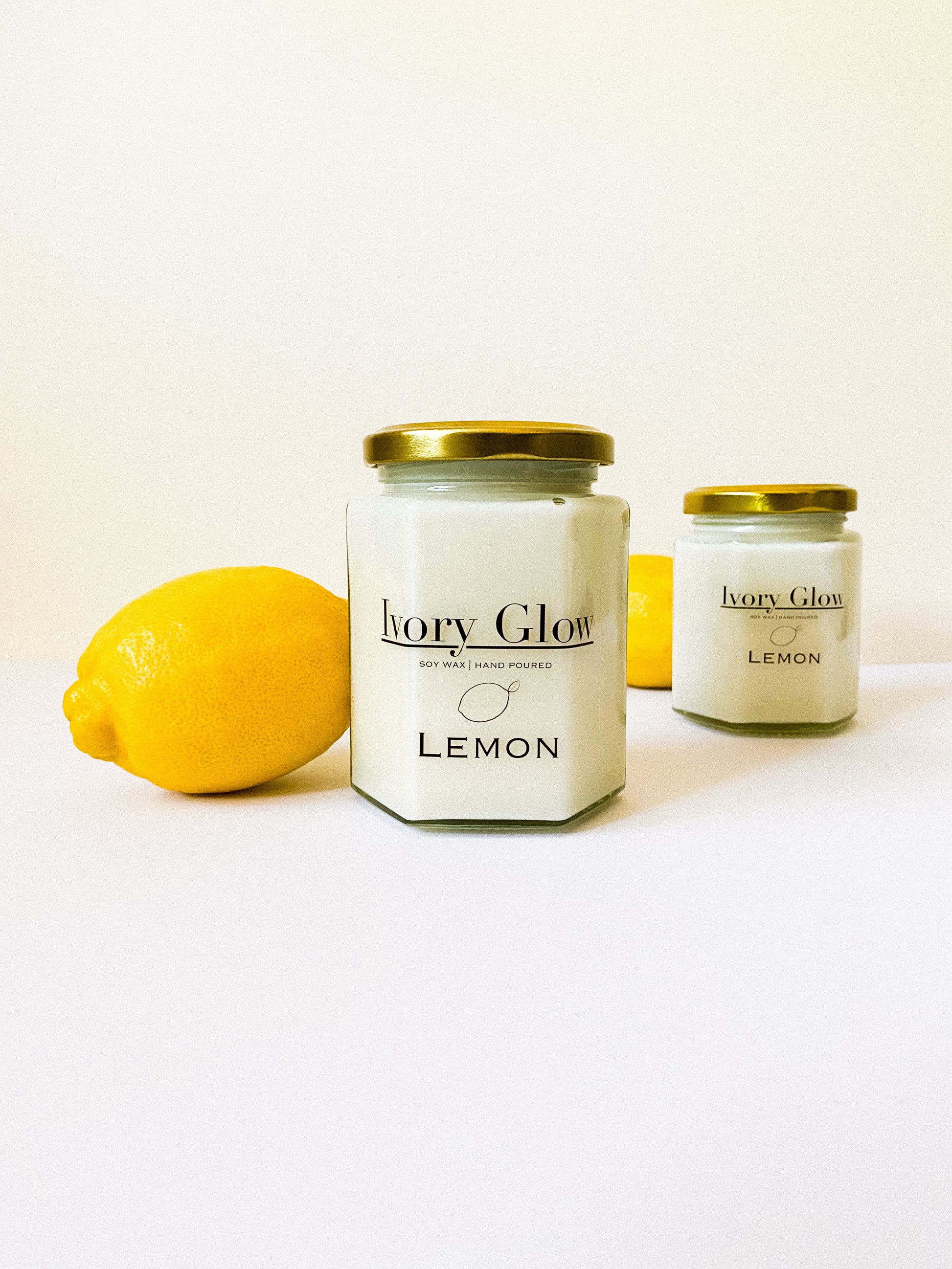 Elegant lemon-scented luxury candle in a chic glass jar, perfect for adding a touch of sophistication and refreshing citrus aroma to any space. Ideal for upscale home decor or as a premium gift.