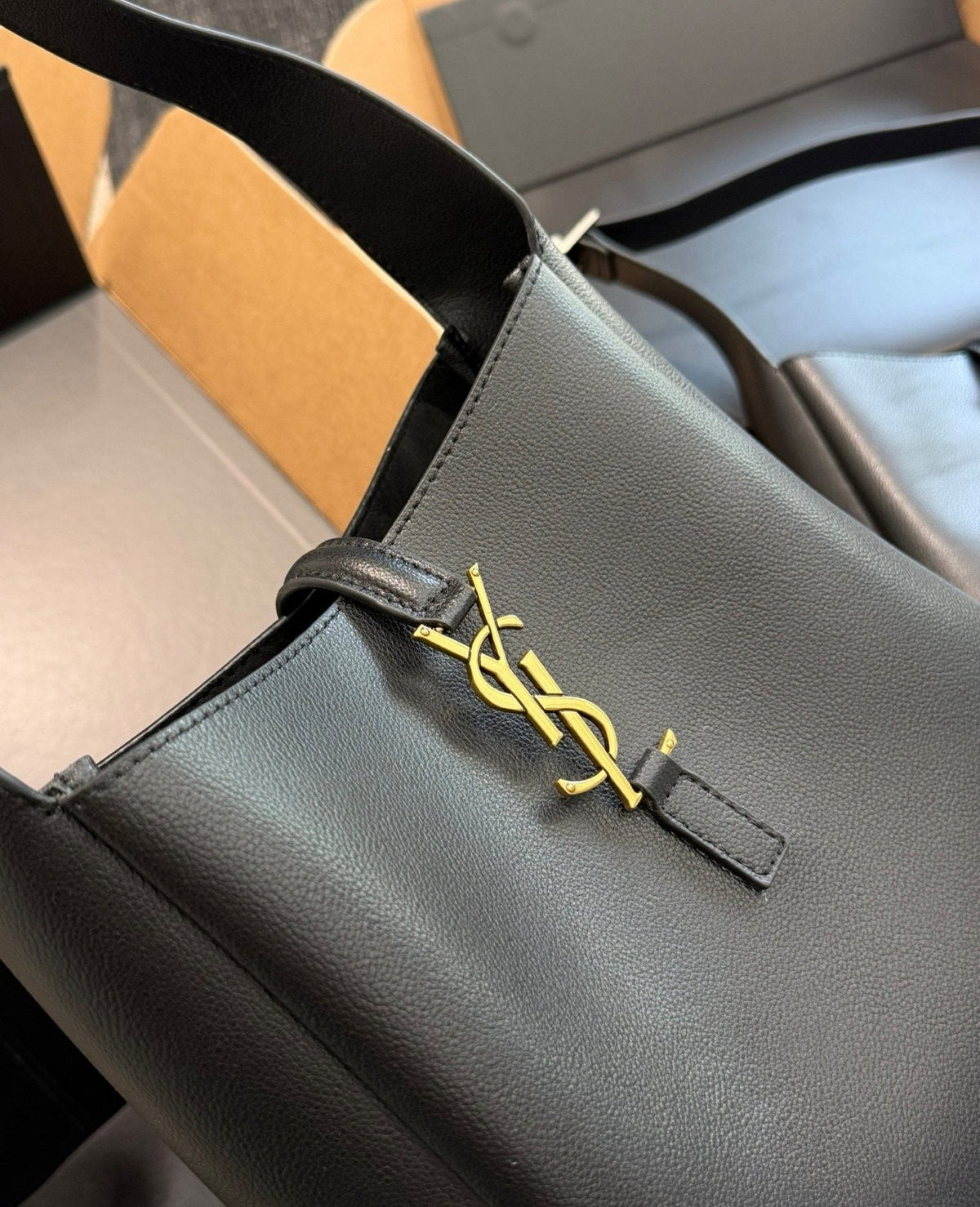 Saint Laurent Black Curved Hobo Shoulder Bag — detail