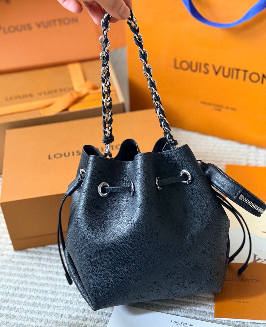Louis Vuitton Bella Perforated Monogram Bucket Bag — model