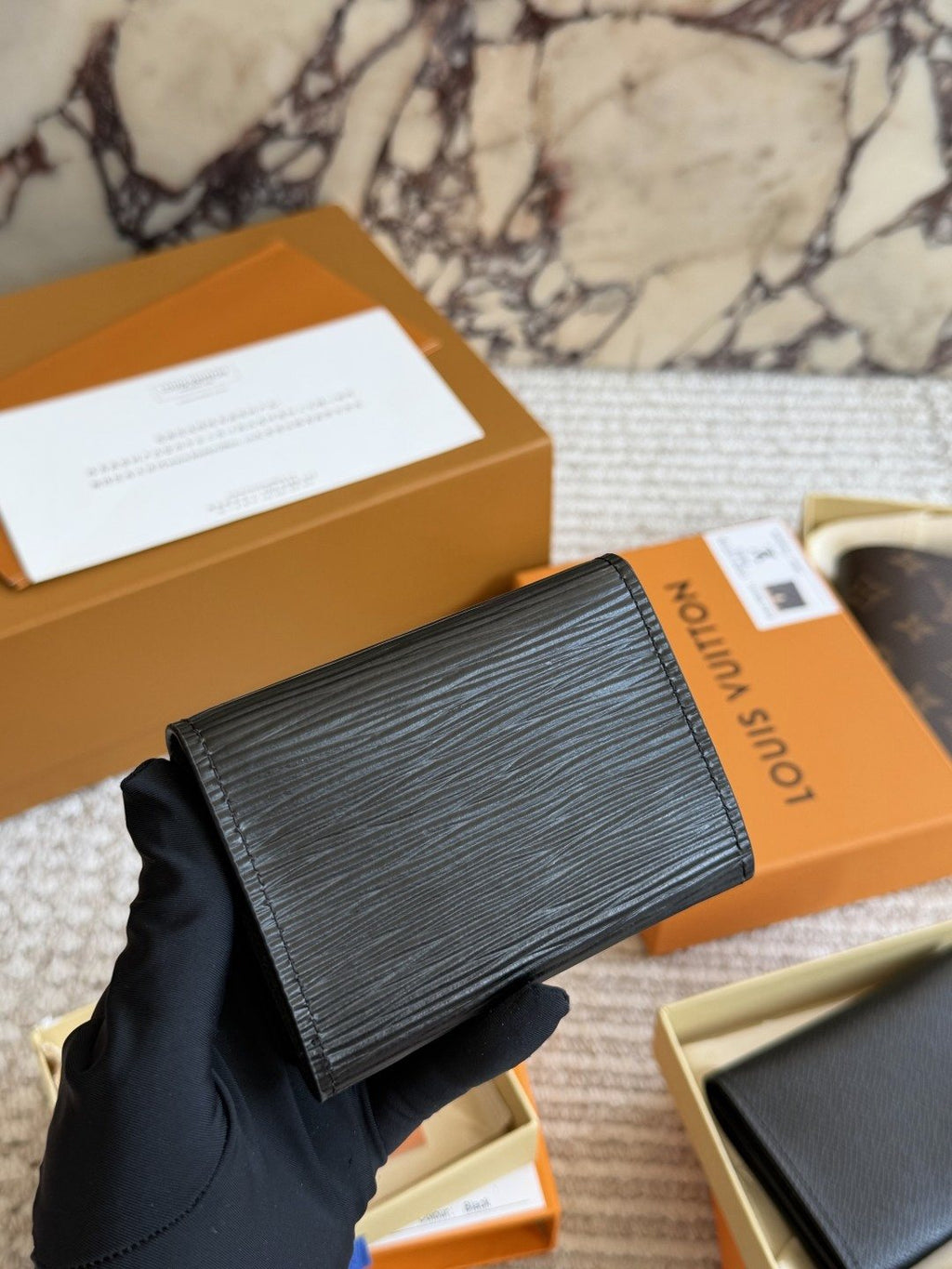 Louis Vuitton Textured Black Folding Card Holder — hero