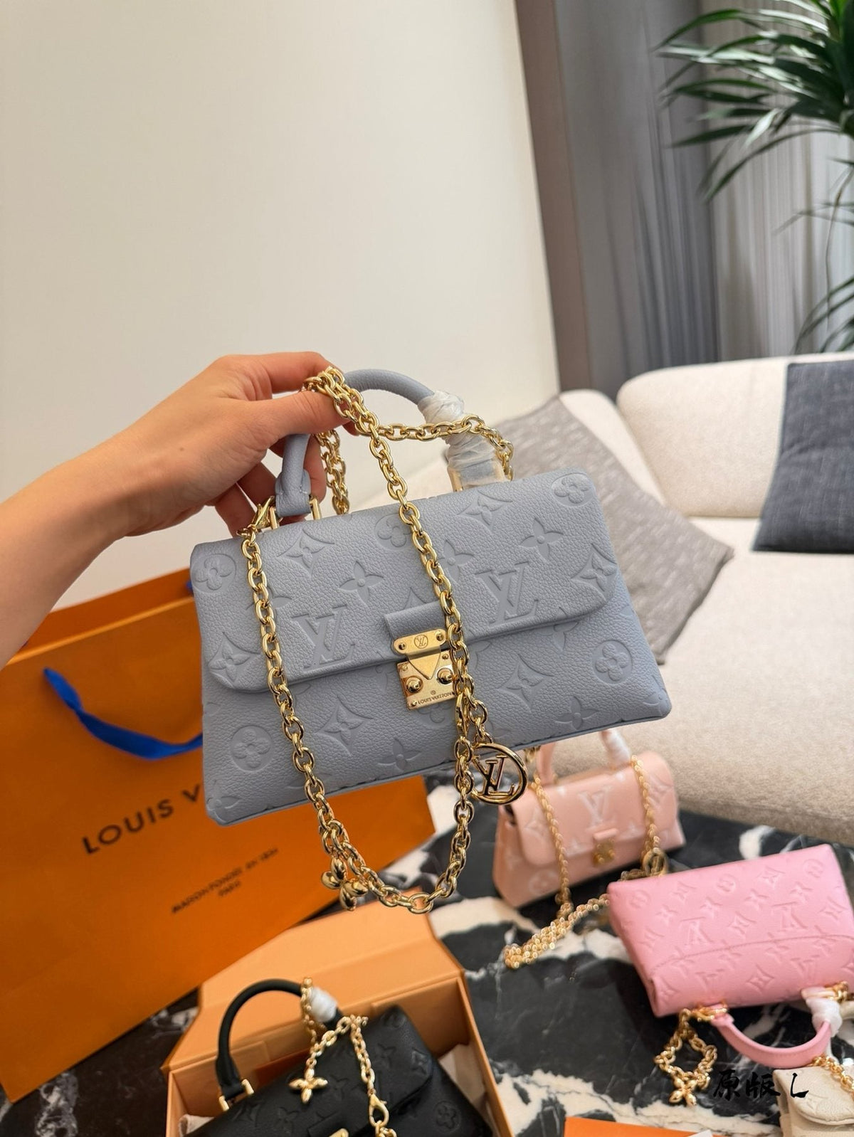 Louis Vuitton Madeleine Nano Top-Handle Flap Bag — model