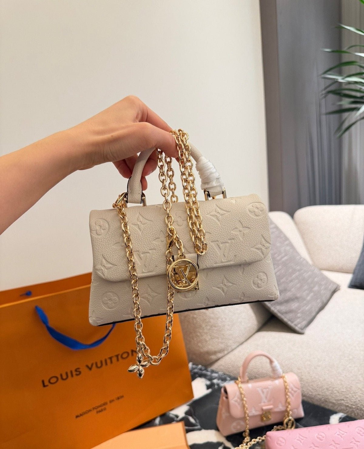 Louis Vuitton Madeleine Nano Top-Handle Flap Bag — model
