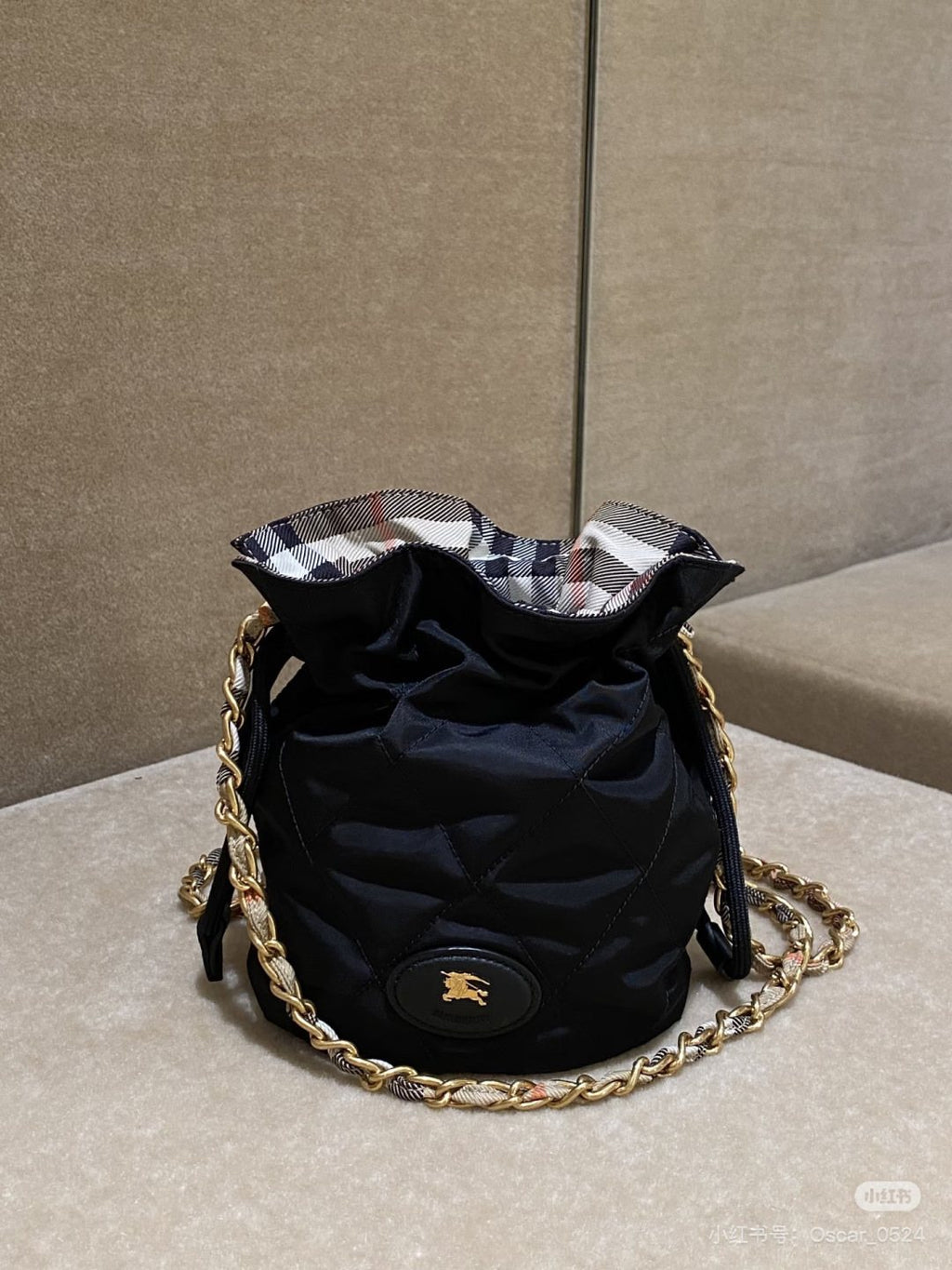 Black Quilted Chain-Strap Bucket Bag — detail