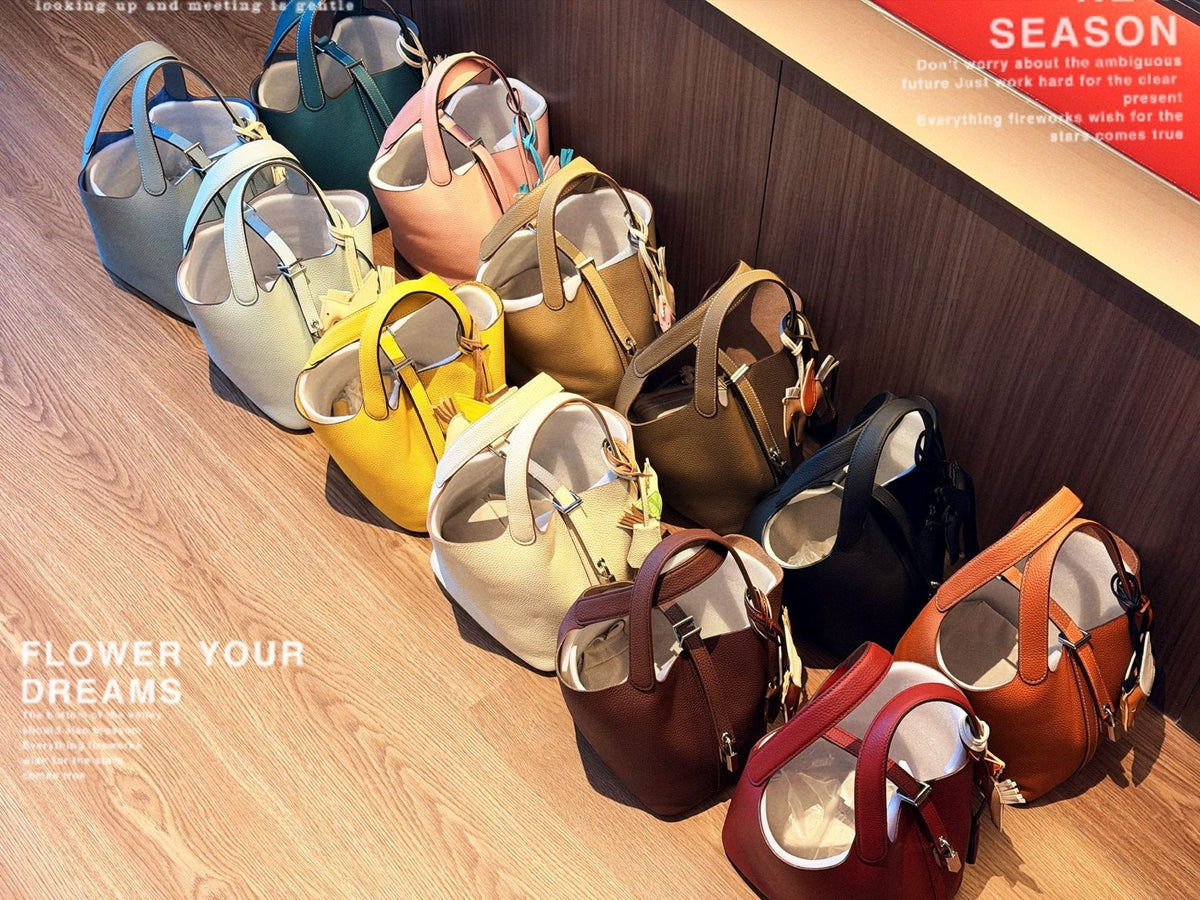 Hermès Curved-Panel Top-Handle Bucket Bag — comparison