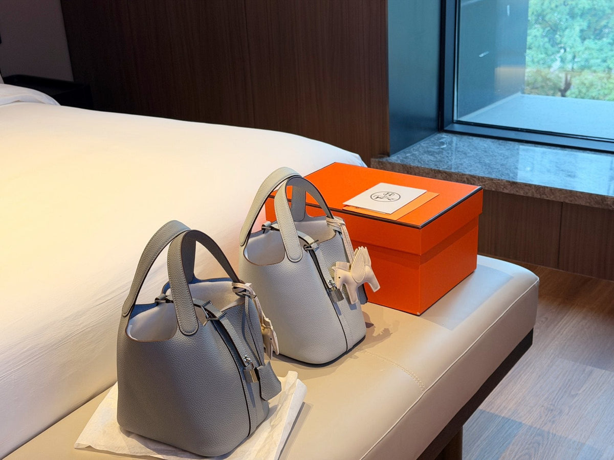 Hermès Curved-Panel Top-Handle Bucket Bag — comparison