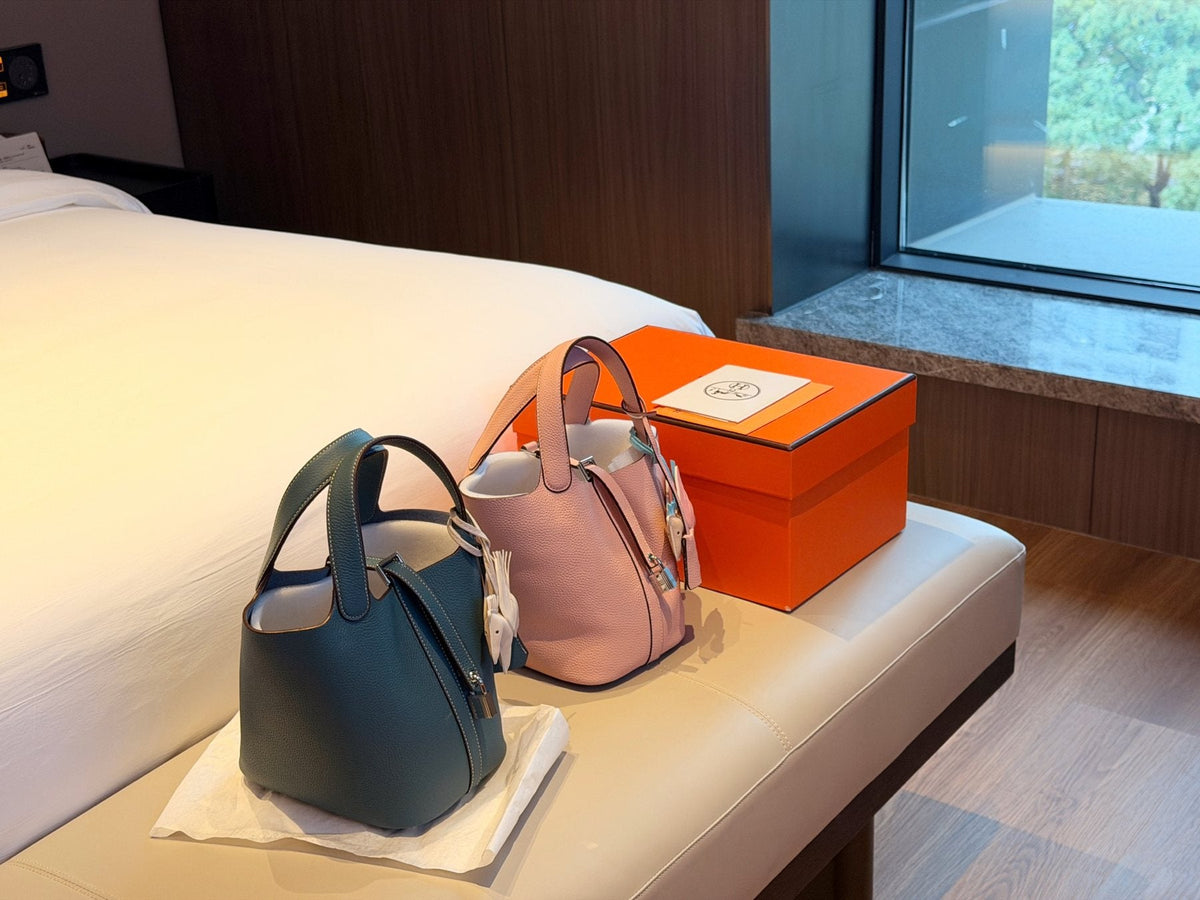 Hermès Curved-Panel Top-Handle Bucket Bag — comparison