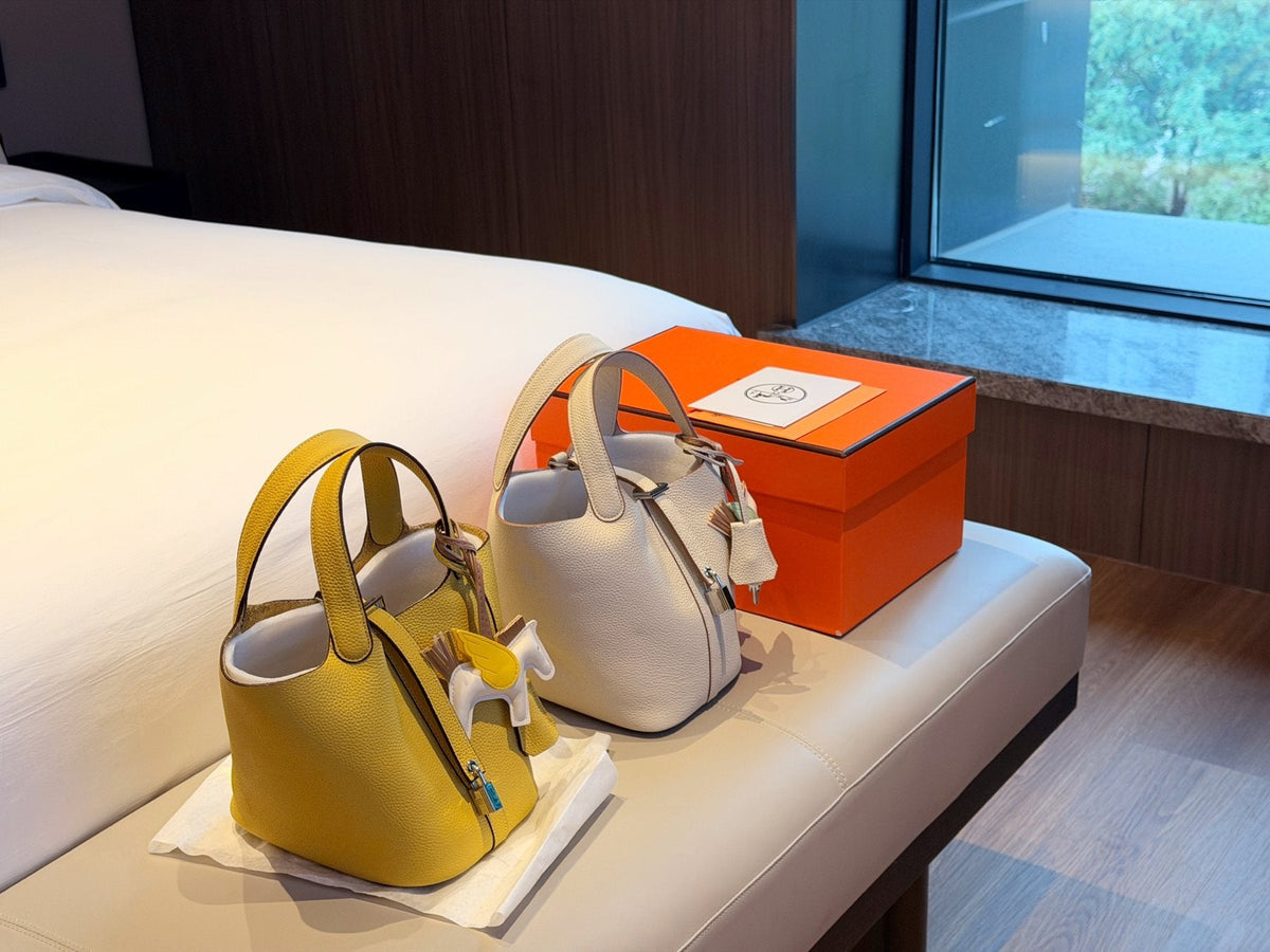 Hermès Curved-Panel Top-Handle Bucket Bag — comparison