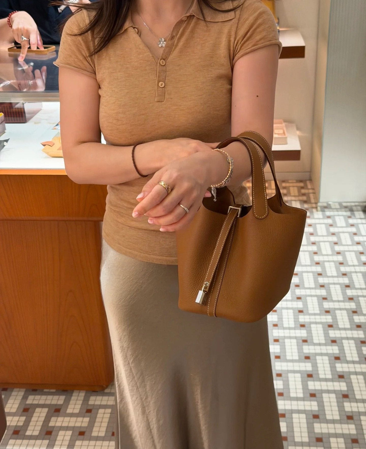 Hermès Curved-Panel Top-Handle Bucket Bag — model