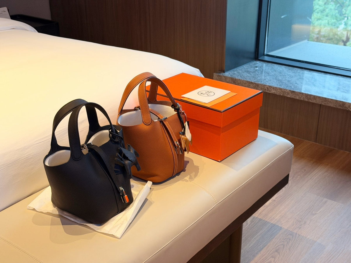 Hermès Curved-Panel Top-Handle Bucket Bag — comparison