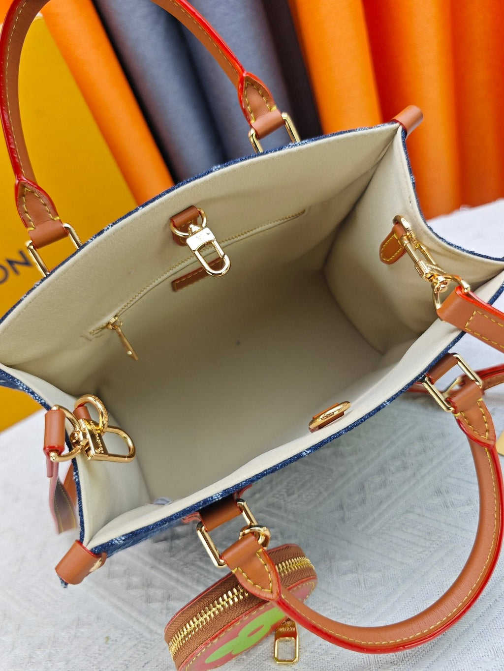 Louis Vuitton OnTheGo Patterned Tote with Round Pouch — detail