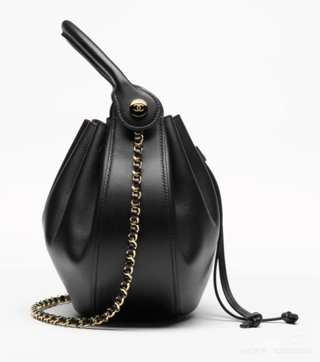 Chanel Black Rounded Drawstring Top-Handle Bag — side